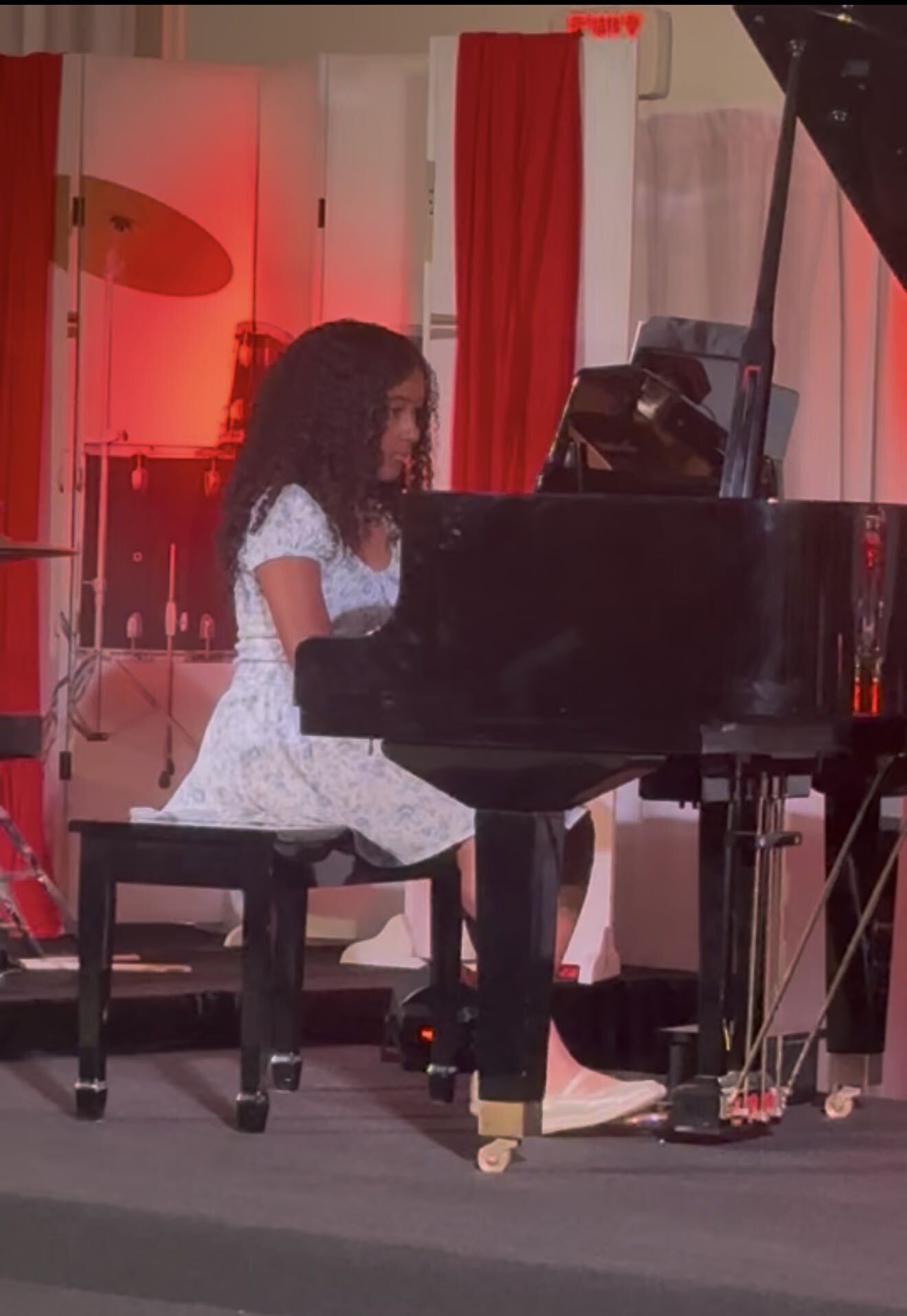 Student performing at a piano recital